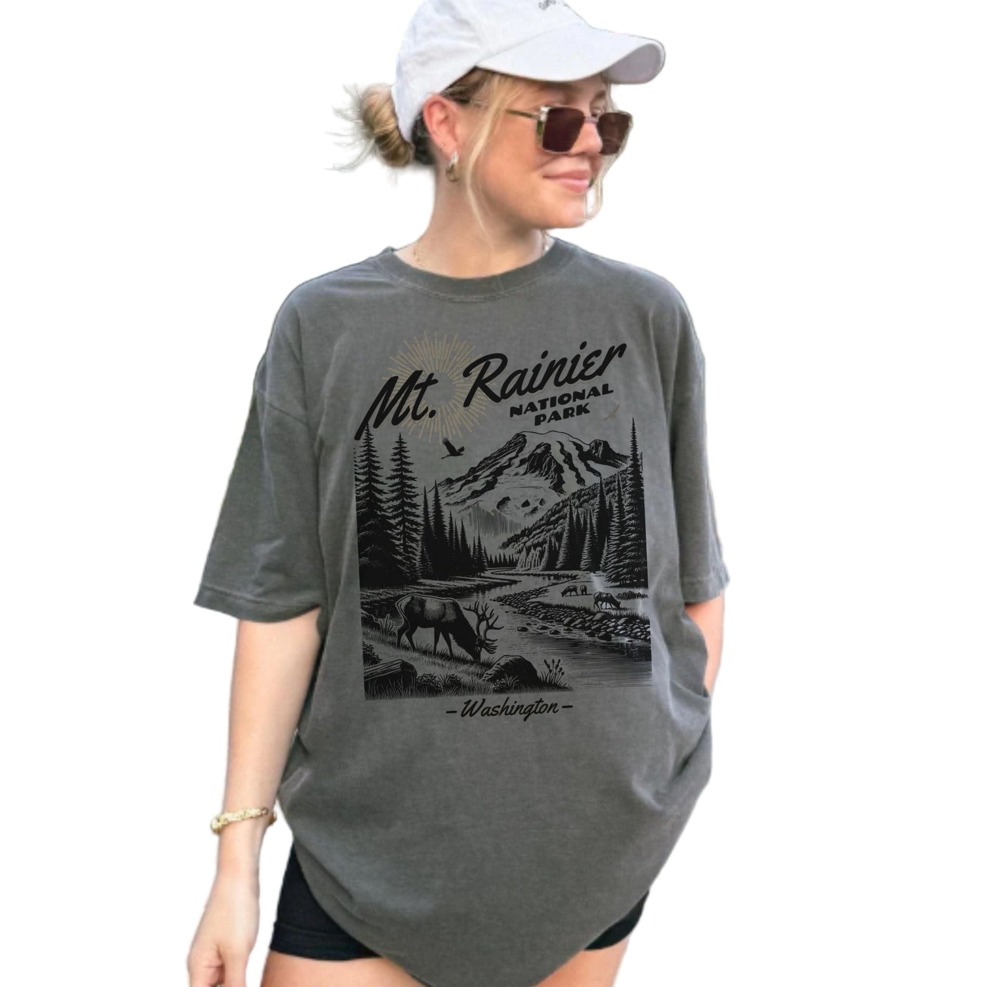 Woman wearing a gray t-shirt with Mount Rainier National Park graphic