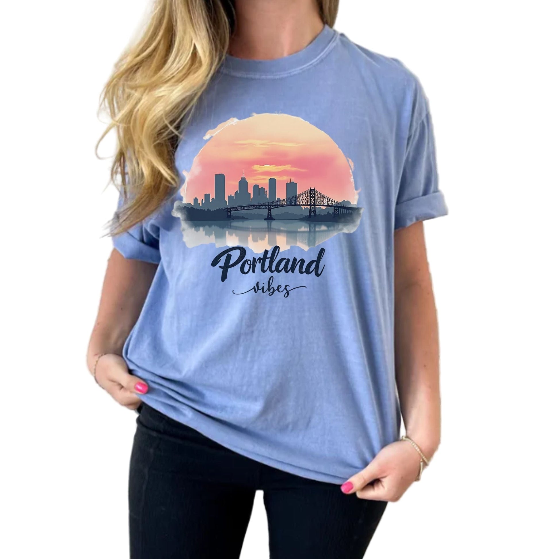 Person wearing a blue t-shirt with 'Portland vibes' design 
